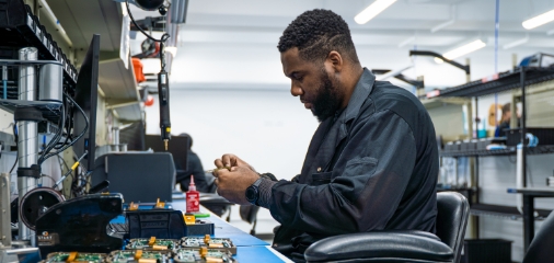 Engineer working on circuit board