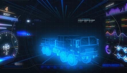 Blue holographic 3D blueprint of a truck displayed in a dark cockpit, surrounded by digital dashboards and data graphs.